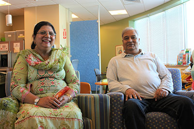 Family Room Parents finding respite steps from their child's hospital bed.