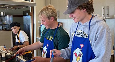 teens cooking at Aurora House with Chef Torie