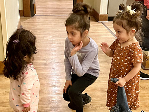 girls playing in kitchen