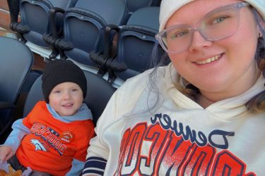mom and son at Broncos game